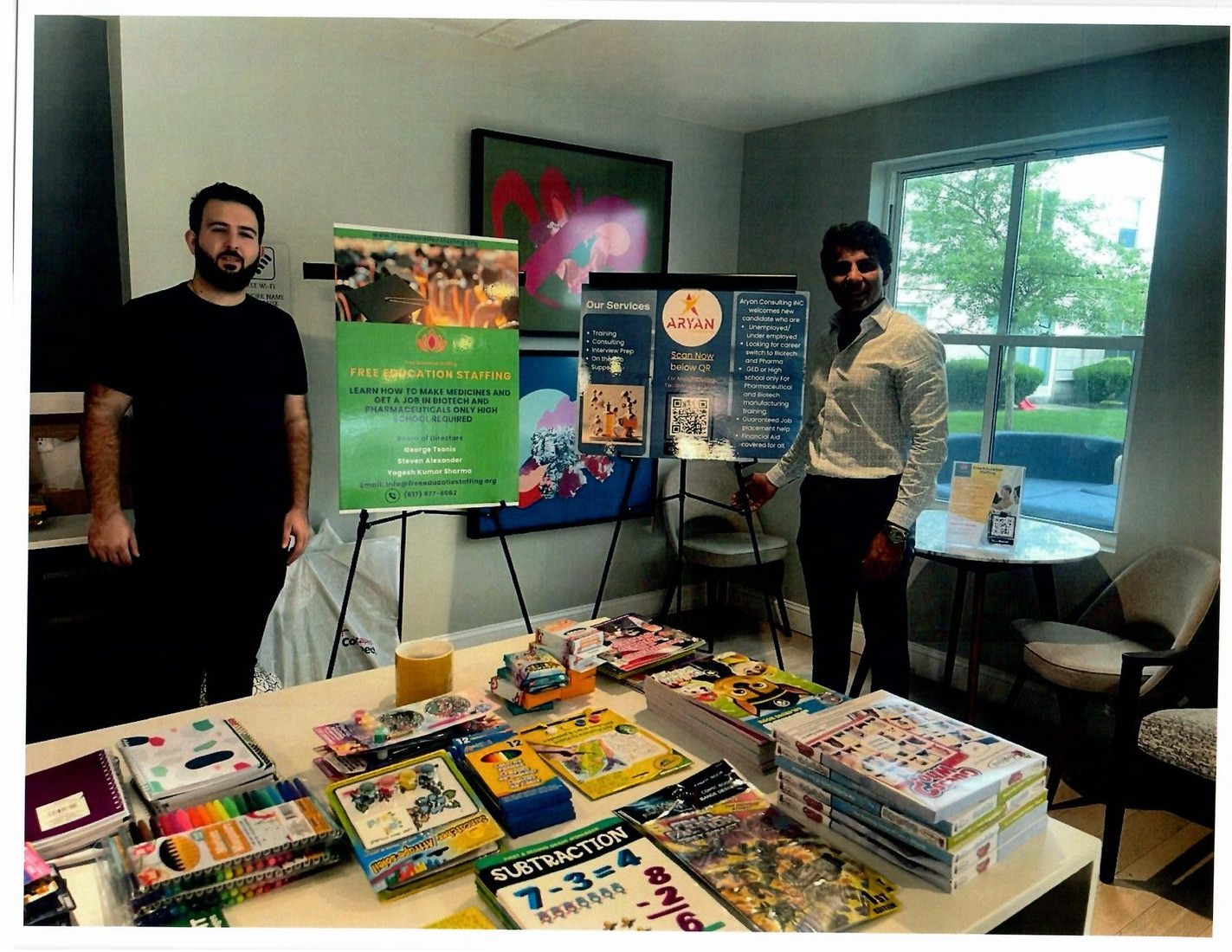 Community outreach table with Free Education Staffing materials